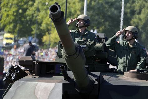 Poland showcases military might in a parade as war rages in neighboring Ukraine